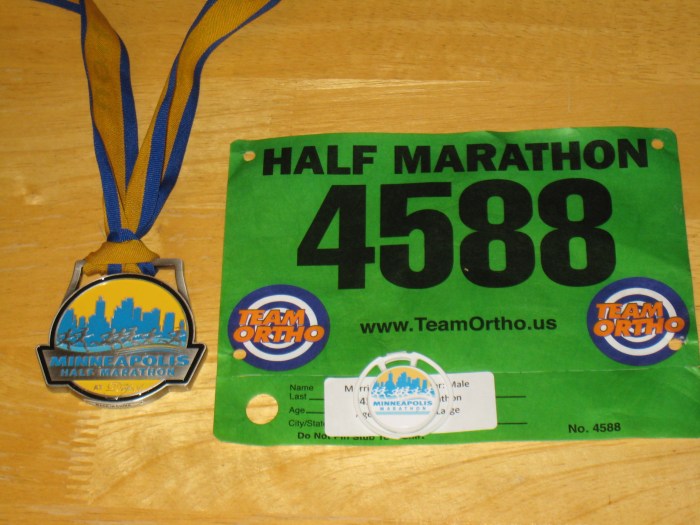 Race medal, race chip, and my bib #